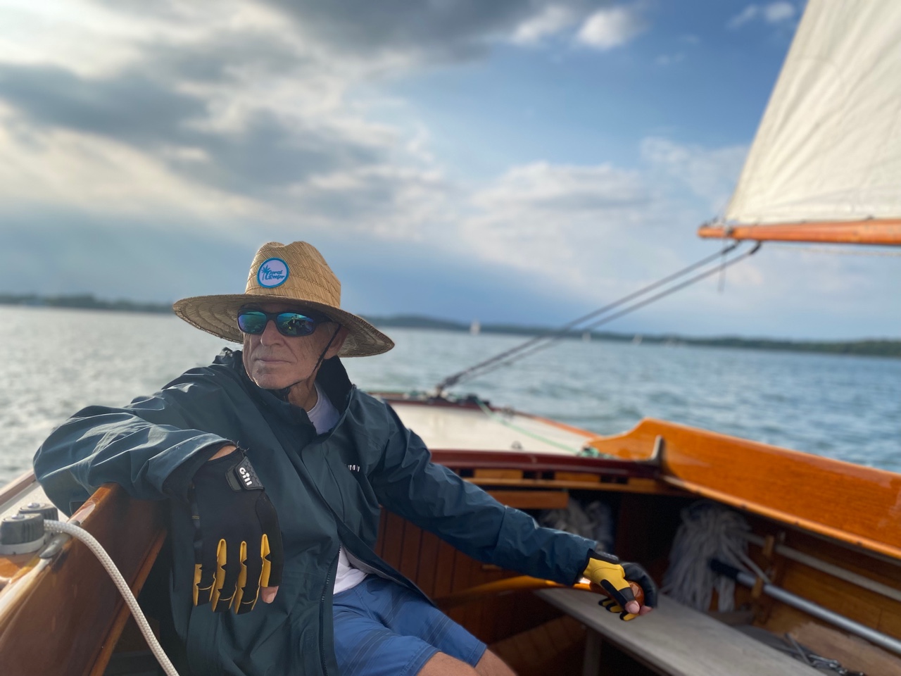 Singer/songwriter Jimmy Buffett on a boat looking off in the distance.